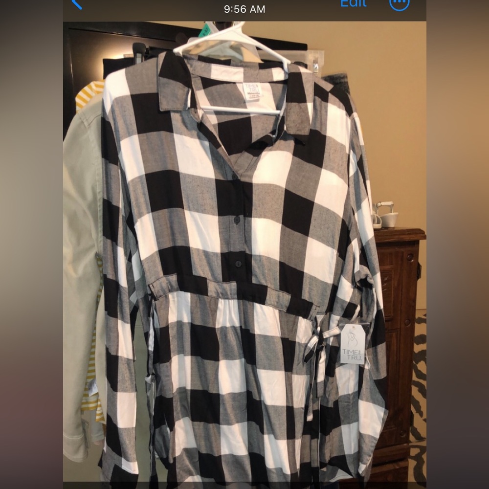 Brand new with tags maternity like shirt with a tie around belt. Size xl